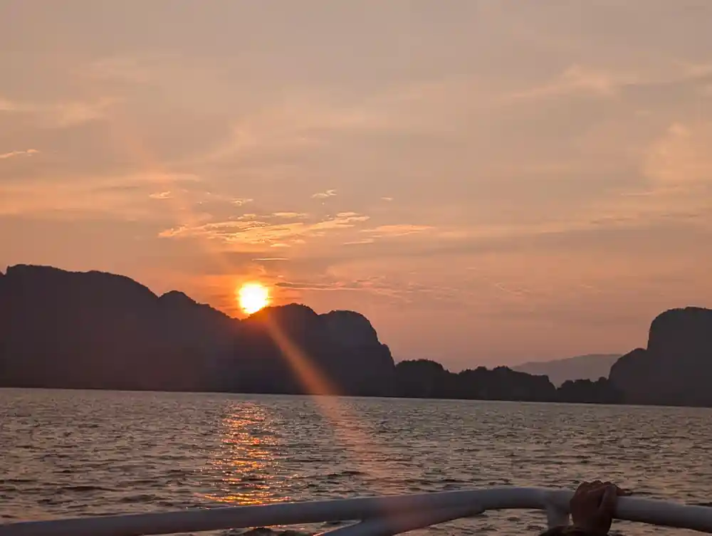Golden sunset behind distant limestone hills