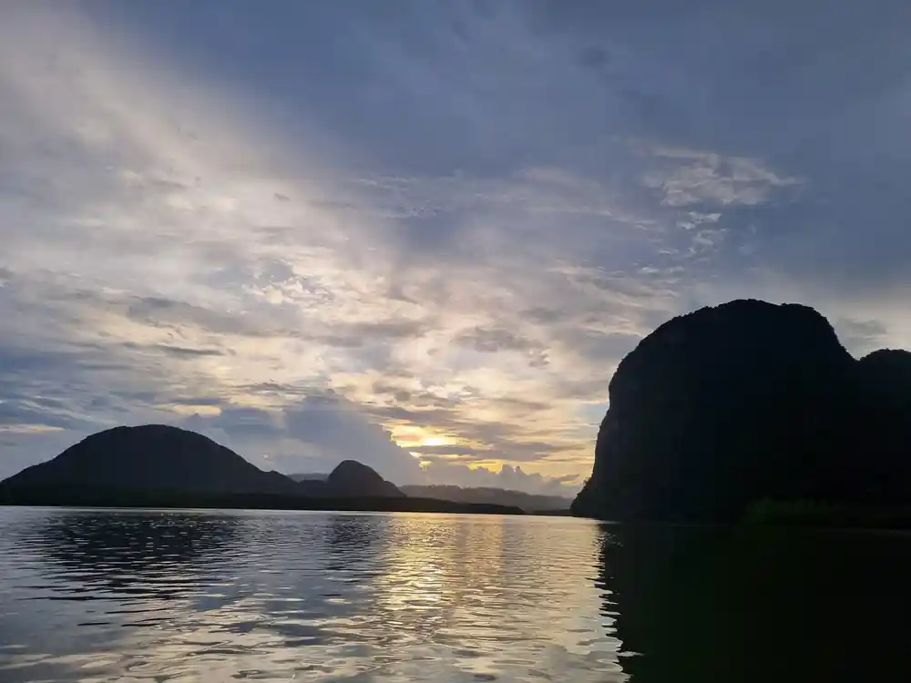 Silhouetted islands and mountains at sunset