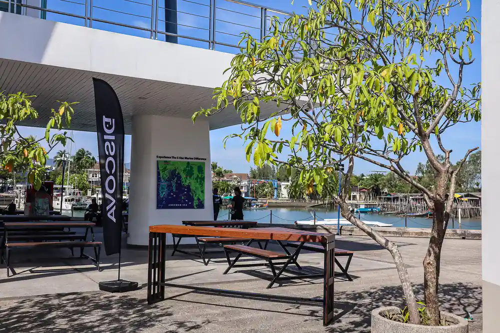 Waterfront building with bench and water view